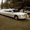 Arrive in a white stretch limo to your beautiful country wedding
