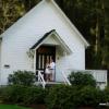 Outdoor wedding photos on the steps of the church